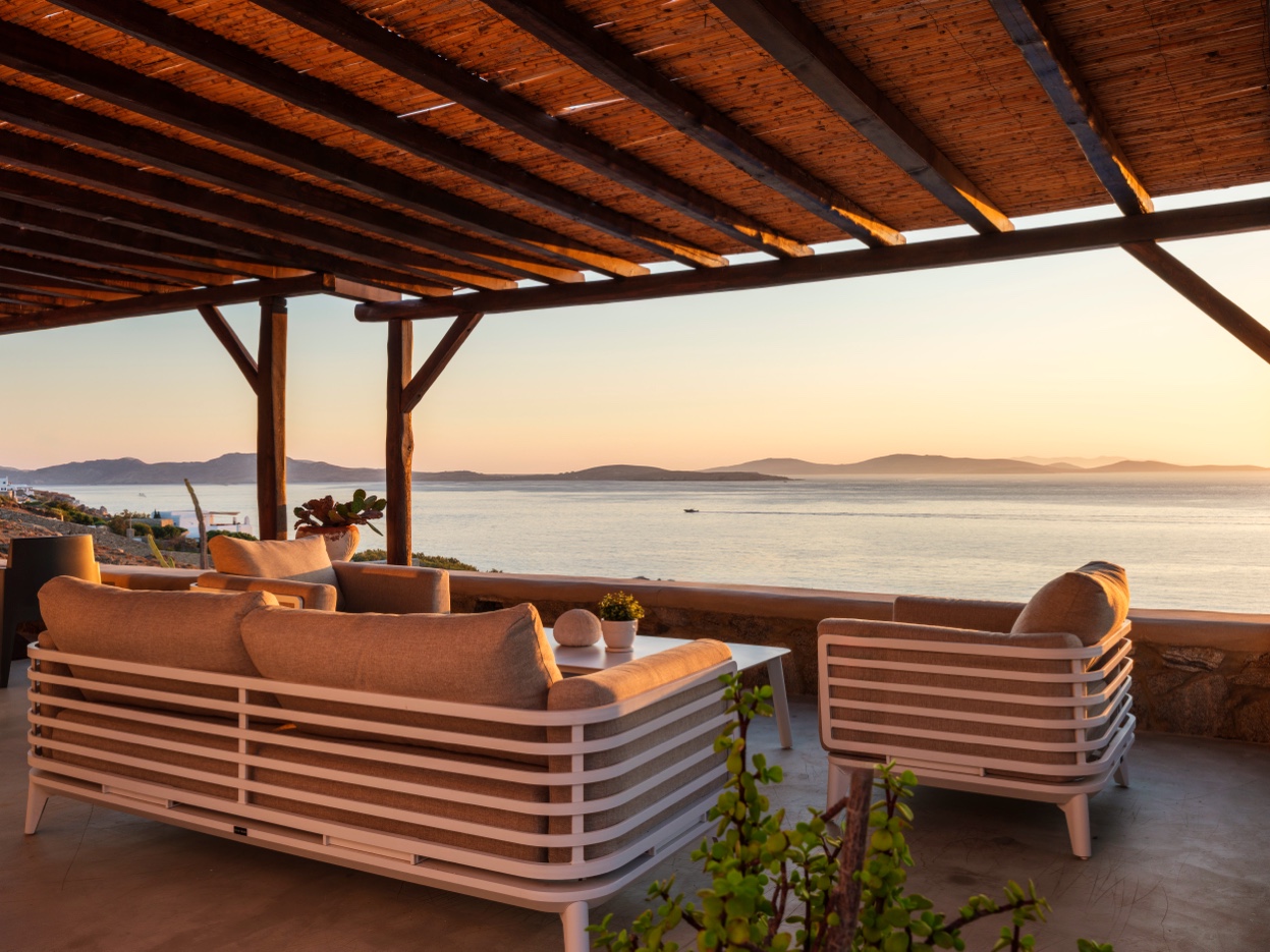 Covered terrace with sea view at golden hour